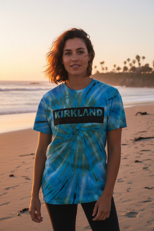 Model wearing blue and green tie-dye swirl t-shirt - beach sunset